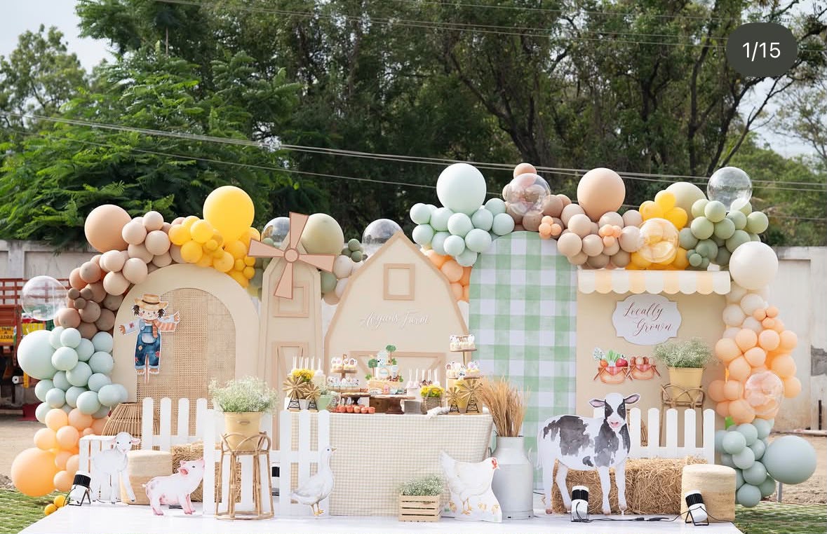 Enchanted pastel fairytale birthday celebration with floral plinths and personalized signage