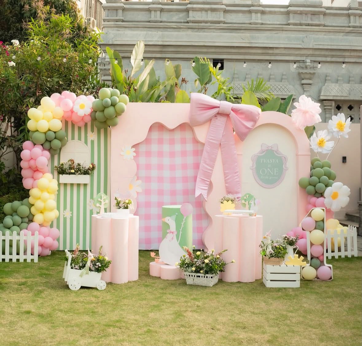 Enchanted safari wild animal birthday backdrop with arches and balloon garlands
