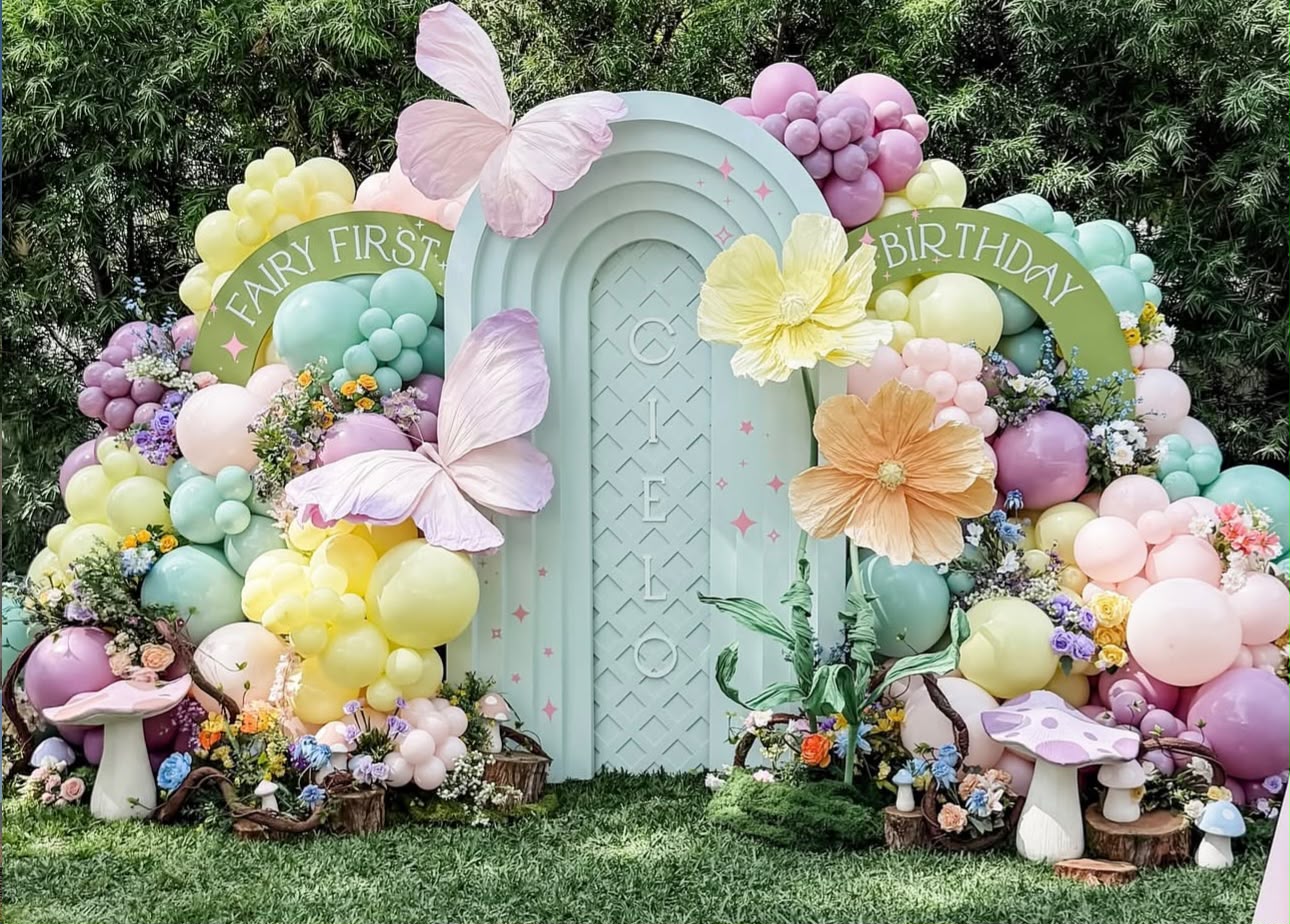 Teddy bear among the clouds pastel blue and beige birthday stage with organic balloon clouds