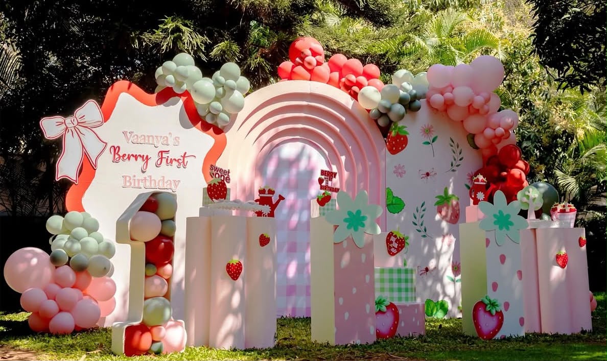 Vibrant carnival themed birthday setup with festive tents and carousel accents