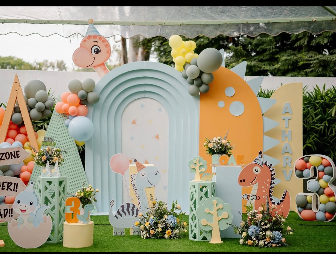 Enchanted butterfly garden fantasy birthday setting with greenery and floral installations