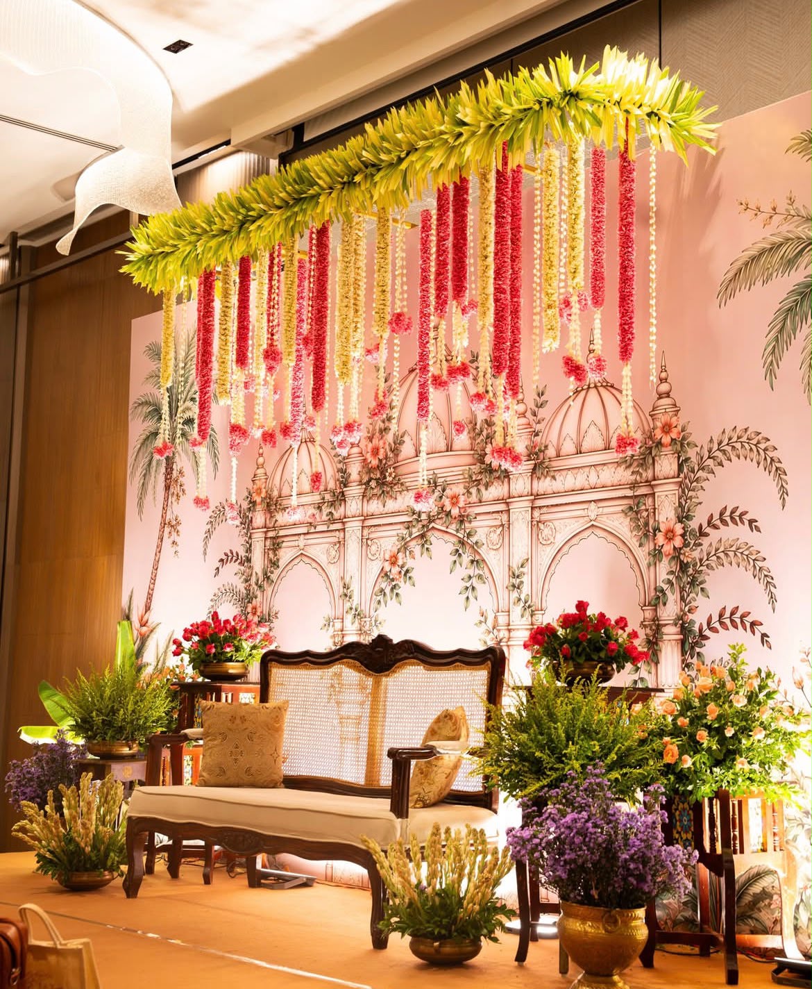 Romantic engagement mandap decor featuring delicate blush roses and ambient fairy lights