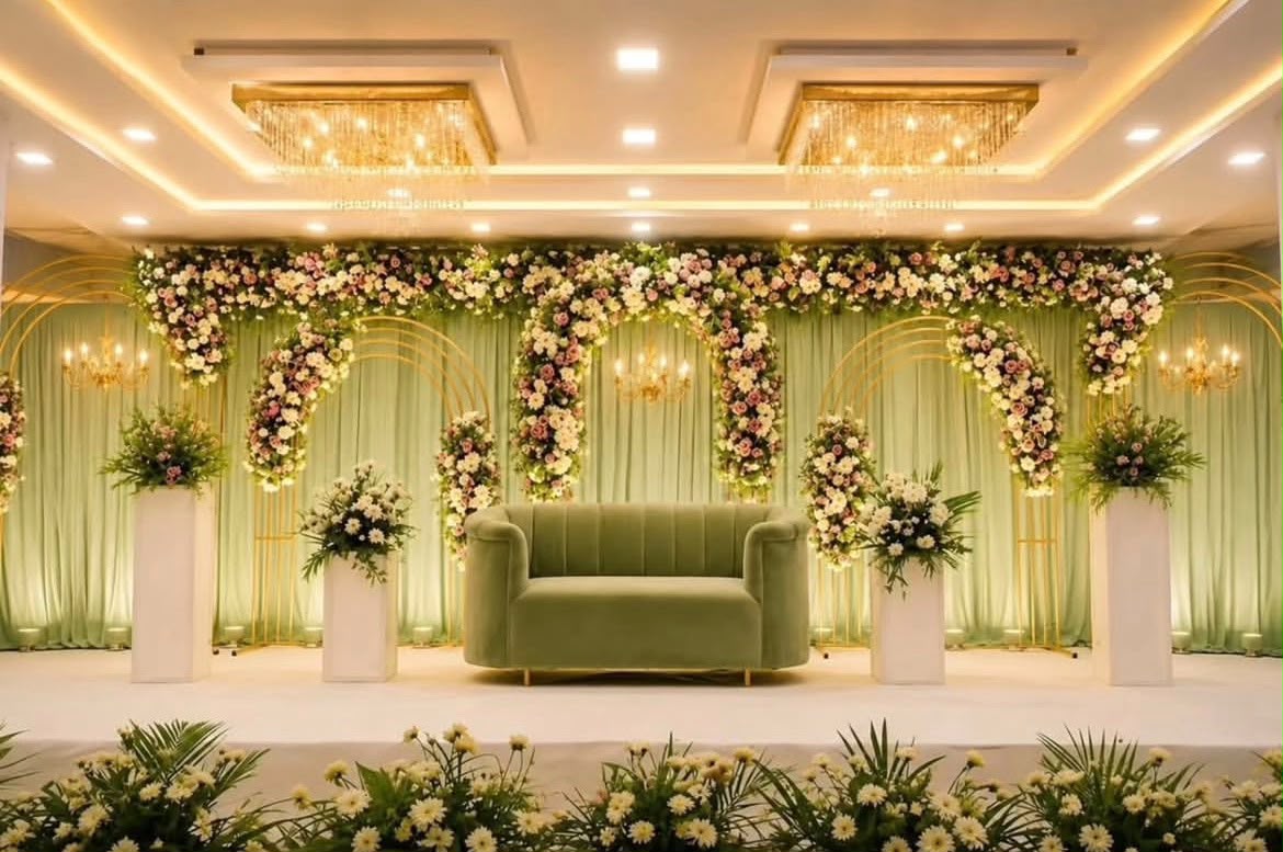 Modern floral engagement photobooth installation with personalized monogram accents