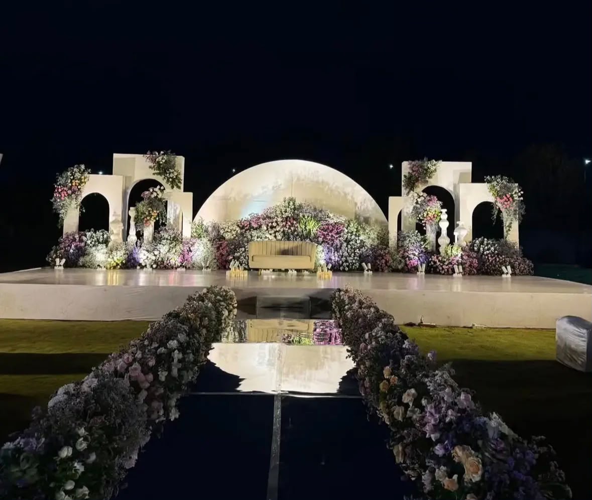 Traditional brass urlis and marigold entrance accents for sacred engagement rituals