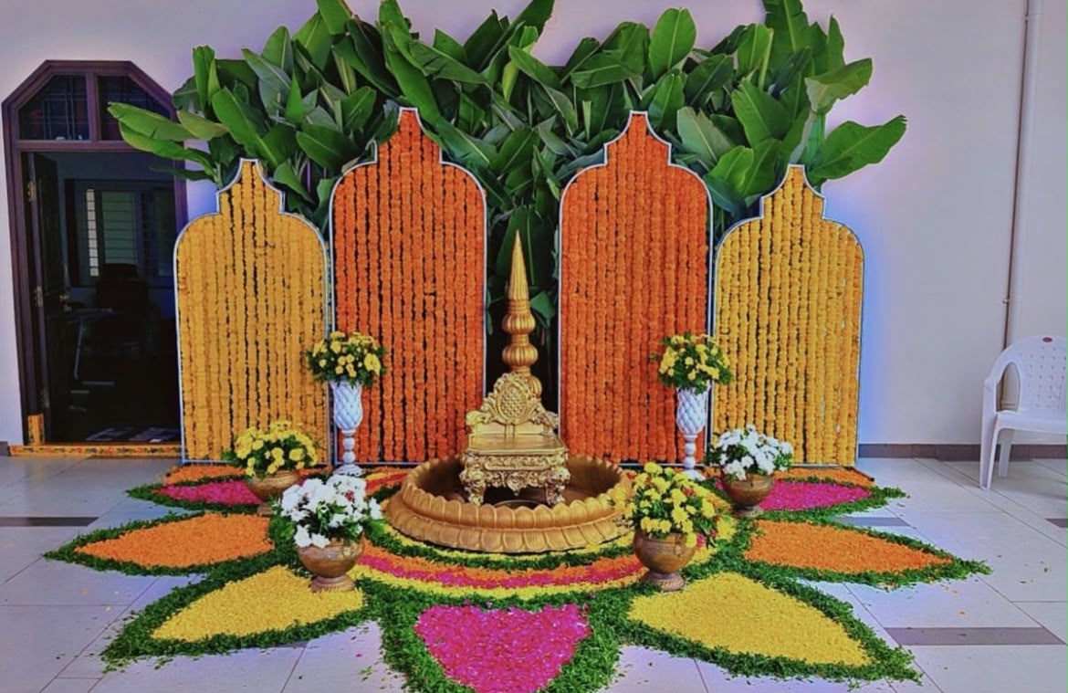 Handcrafted yellow floral chandelier and hanging marigold drapes