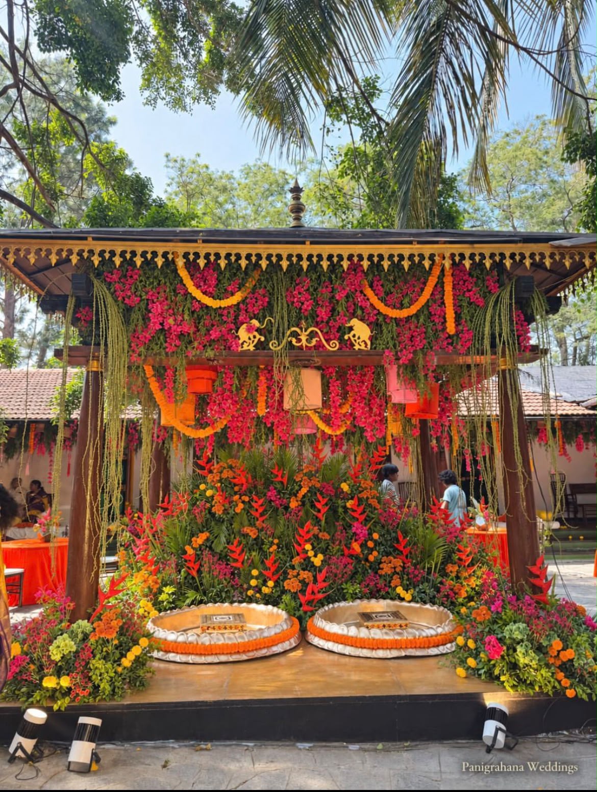 Traditional silver mortar and pestle (rolu) decorated for haldi grinding ritual