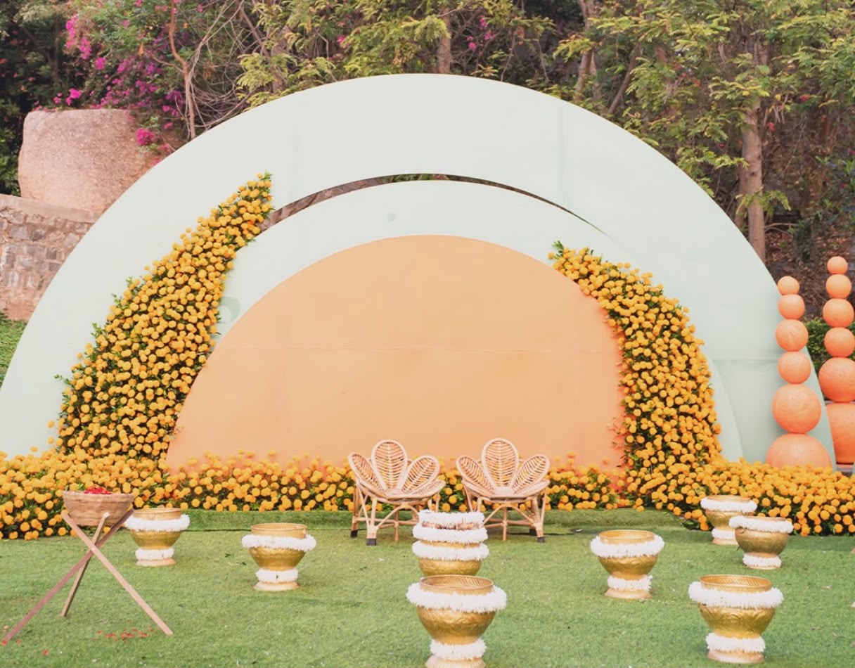 Traditional Telugu pasupu decor with brass kalyana urlis and flower bowls