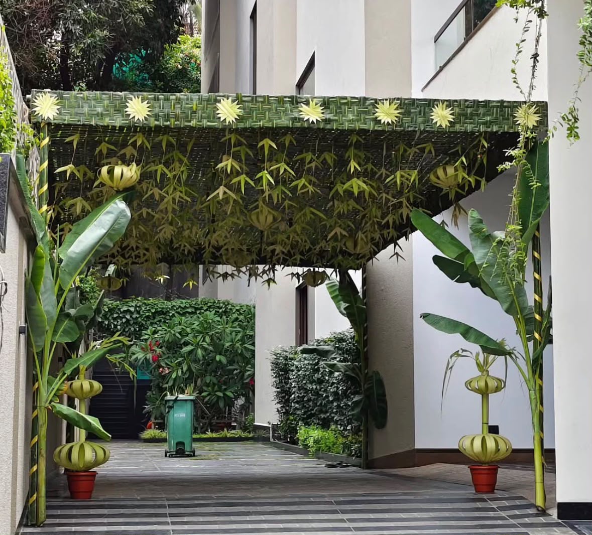 Intimate home balcony celebration styling with hanging planters and warm fairy lights