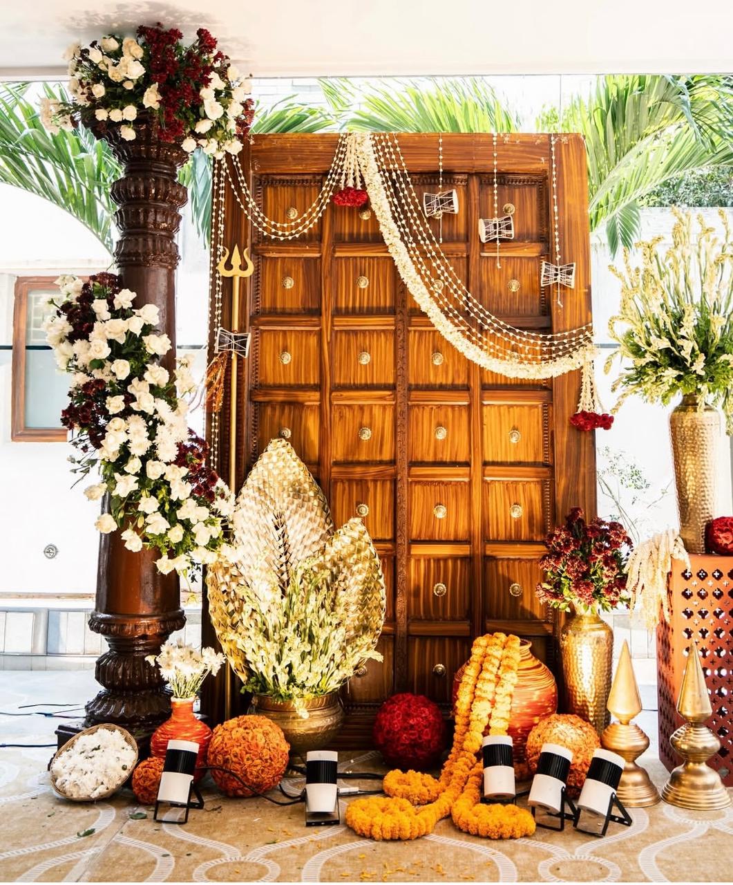Earthy terracotta and brass deity backdrop curation for traditional rituals