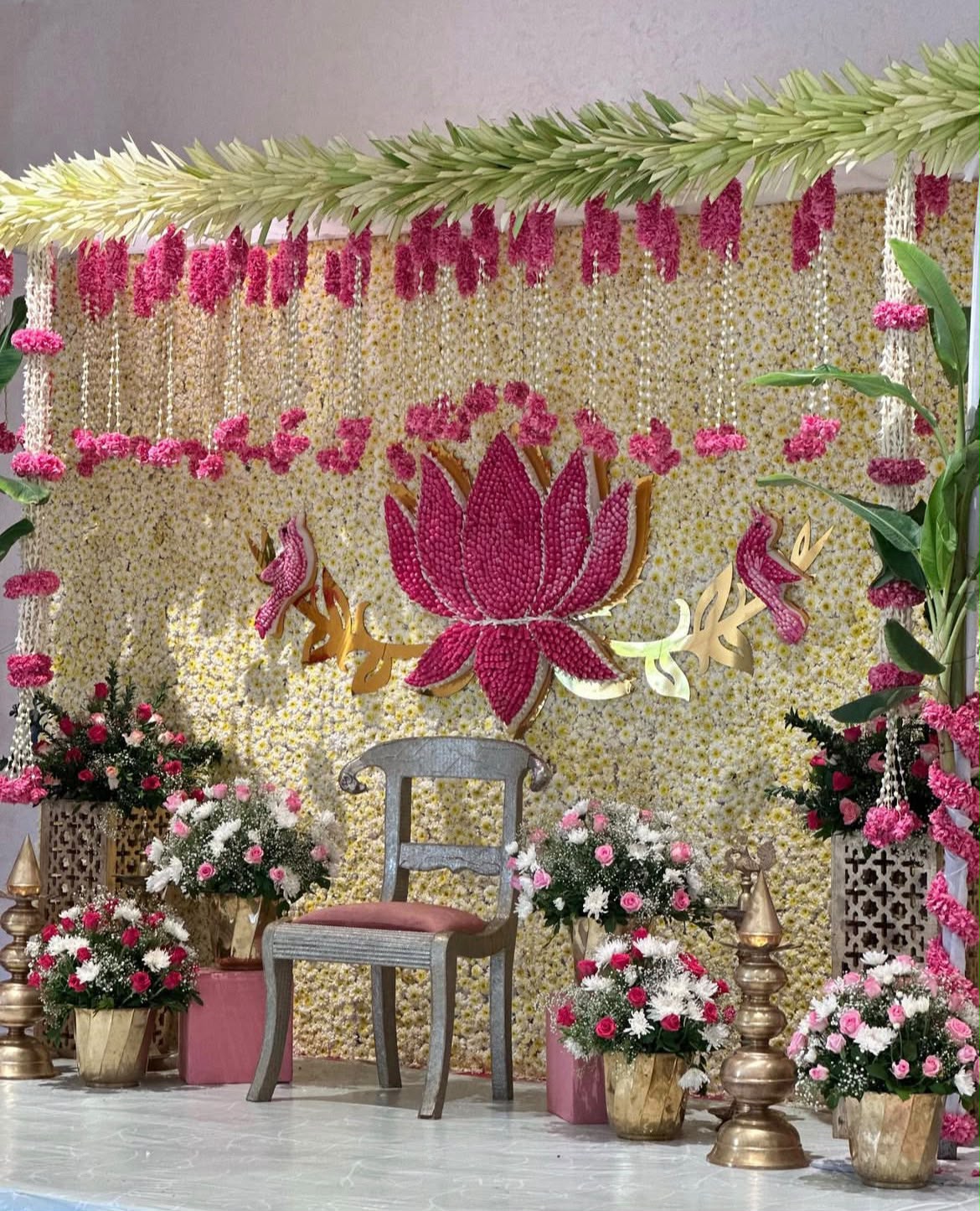 Sacred bridal blessing stage setup with fragrant floral hangings by The Utsav House
