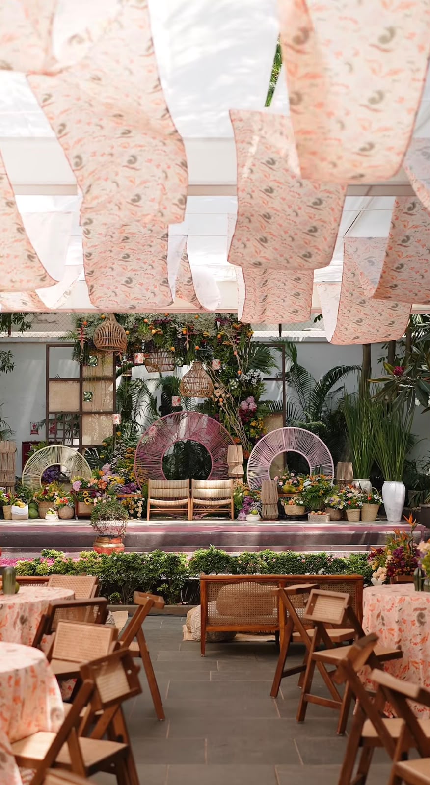 Luxury reception stage with panoramic floral installation and bespoke couple seating
