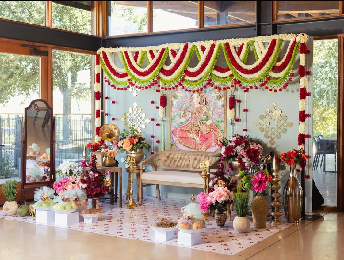 Contemporary reception stage styling with metallic geometric motifs and royal drapery