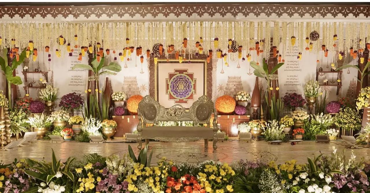 Intricate crystal and floral stage backdrop for luxury wedding reception evenings