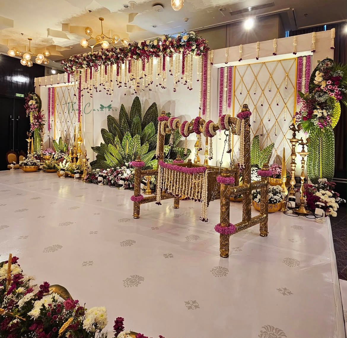 Radiant festive hall adorned with multi-tiered floral chandeliers and warm ambient glow