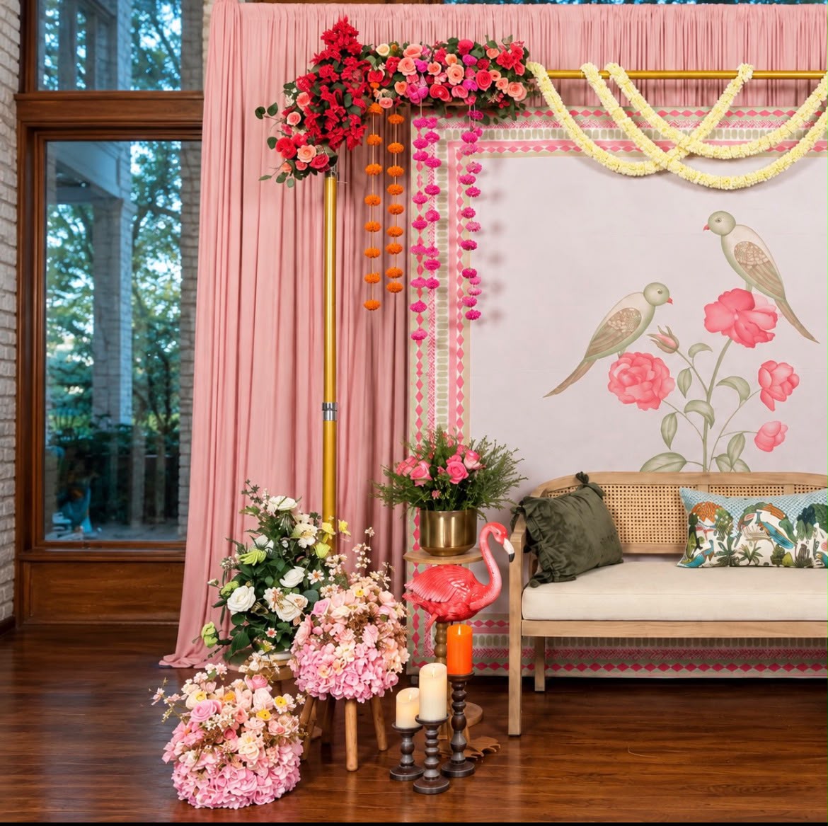 Heritage festive veranda setup with hanging flower strings and brass urlis with floating candles