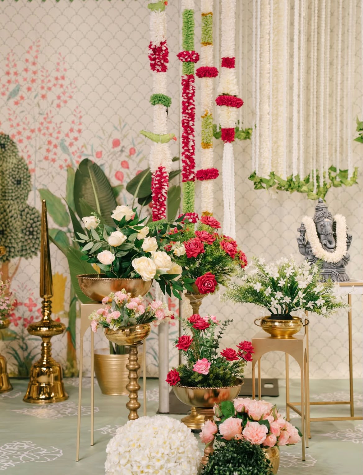 Auspicious festive naming ceremony stage with floral ring swing and handcrafted motifs