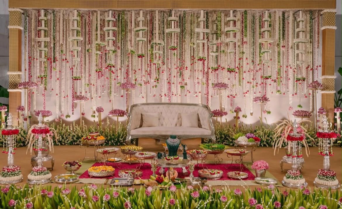 Intimate traditional pooja sanctuary adorned with fragrant tuberose and golden lighting