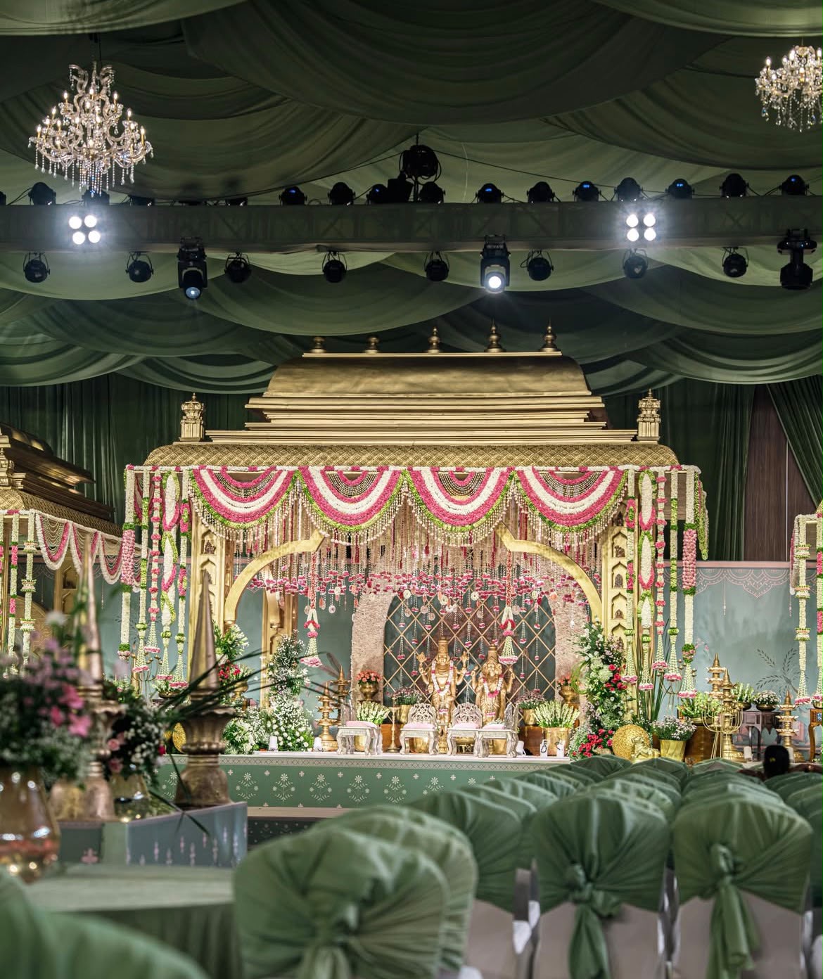 Spectacular outdoor wedding altar with floral archway overlooking lush greenery